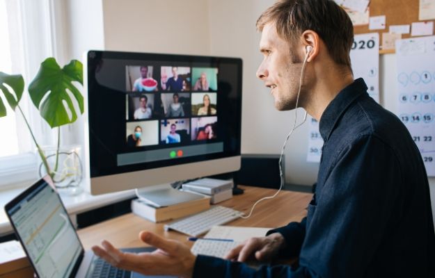 A man having video call via computer at home | A Manager Organizes and a Leader Innovates