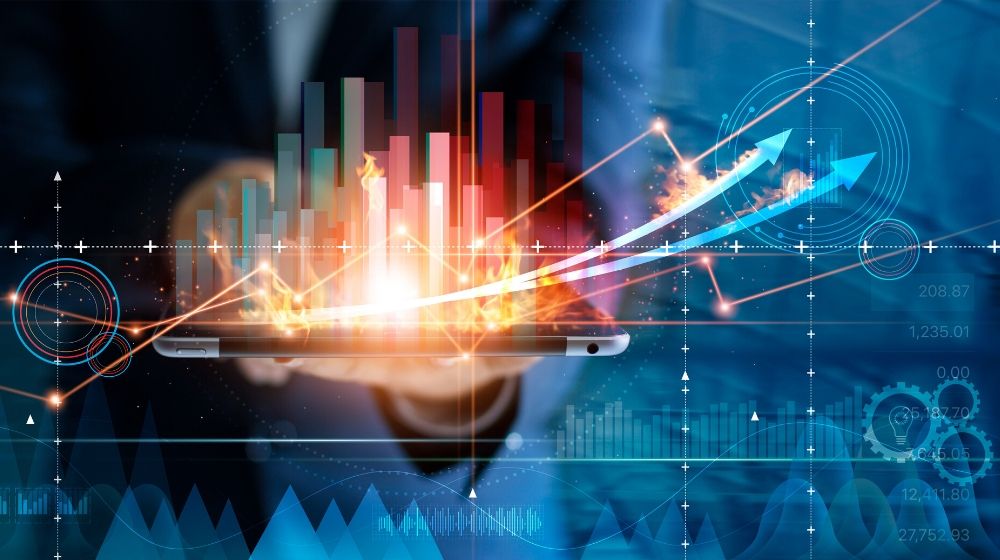 Hot business growth. Businessman using tablet analyzing sales data and economic growth graph chart. Business strategy, financial and banking. Digital marketing