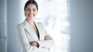 Smiling Female Business Leader With Arms Crossed