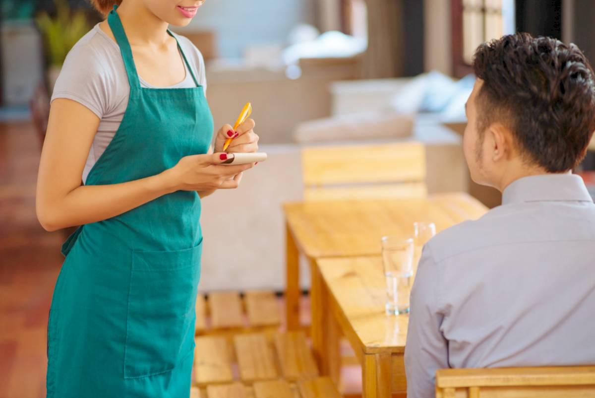waitress taking order of her customer | Cross Selling And How It Can Drive Growth and Profitability To Your Business | cross-selling | crossselling