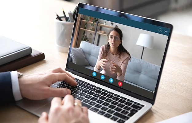 a business man and woman having online video call