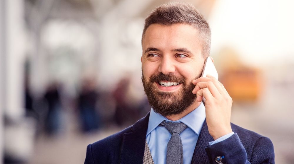 a business man talking on the phone | feature image