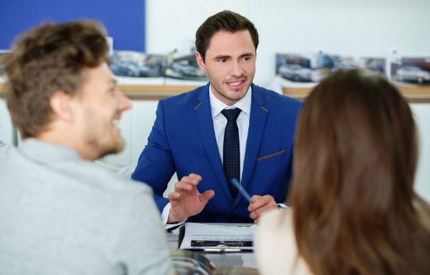 a sale man talking to clients | Client