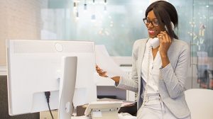 a woman having a phone call by the working desk