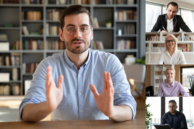 Bearded young man with glasses holding a meeting with coworkers | Make Human Connections​