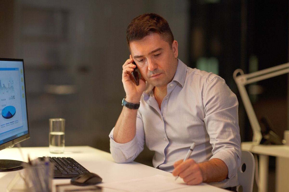 Businessman making a phone call | Cold Calling Secrets: How To Eliminate Fear, Failure, And Rejection | Silhouette of businessman using laptop in the office | Cold Calling Secrets: How To Eliminate Fear, Failure, And Rejection | sales dialer