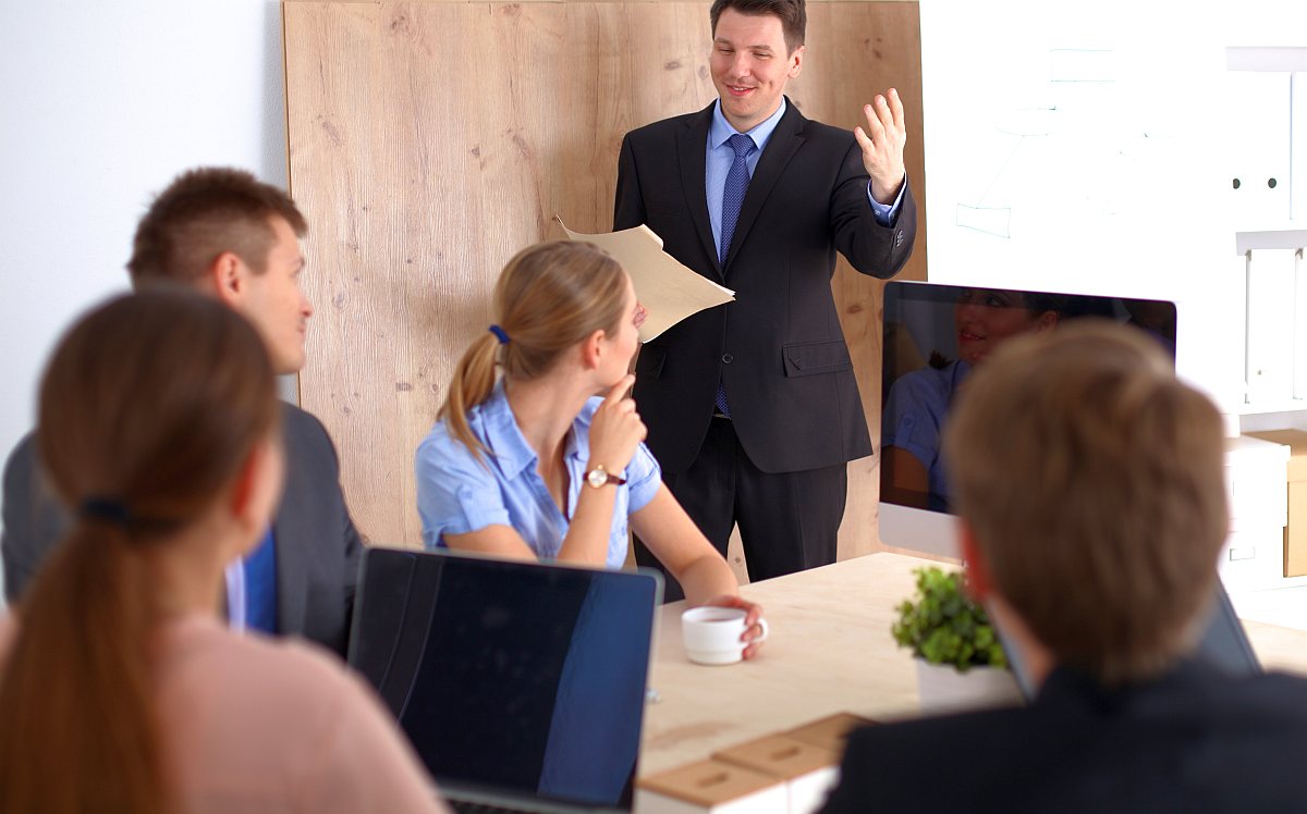 Team meeting in board room | How Salesforce Does Sales Development