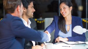 Businessman shaking hands with a colleague in the office