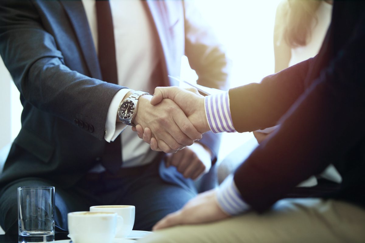 Two gentleman shaking hands | Breaking Through the Client Is Tough | Prospecting Myths Debunked