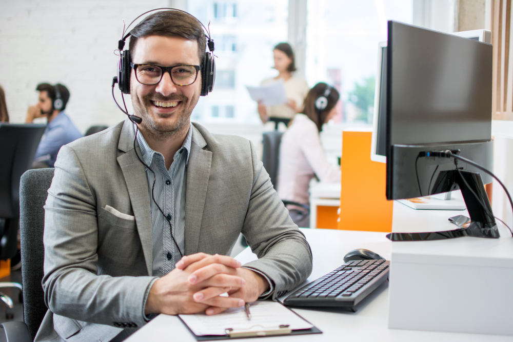 Business man with headset in call center | Effective Cold Calling Tips For B2B | B2B cold calling | sales enablement