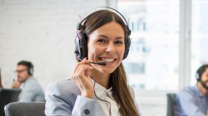 Female customer support operator working in call center