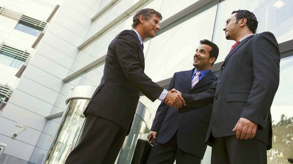 Group of businessman shaking hands outside the office | How To Become An Agile Inside Sales Rep | inside sales representative | what is inside sales