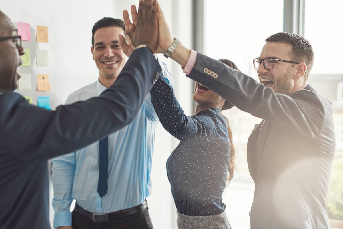 multiracial business team giving high five | Secrets of Successful Business Sales Development Leaders | business development manager | business development associate