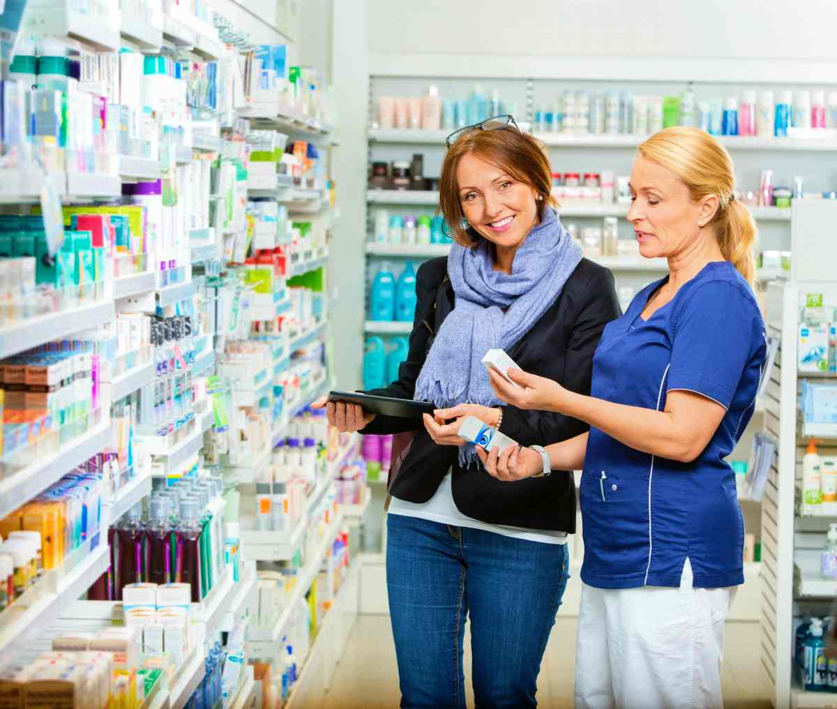 female customer standing with a chemist | Cross Selling And How It Can Drive Growth and Profitability To Your Business | cross-selling | crossselling