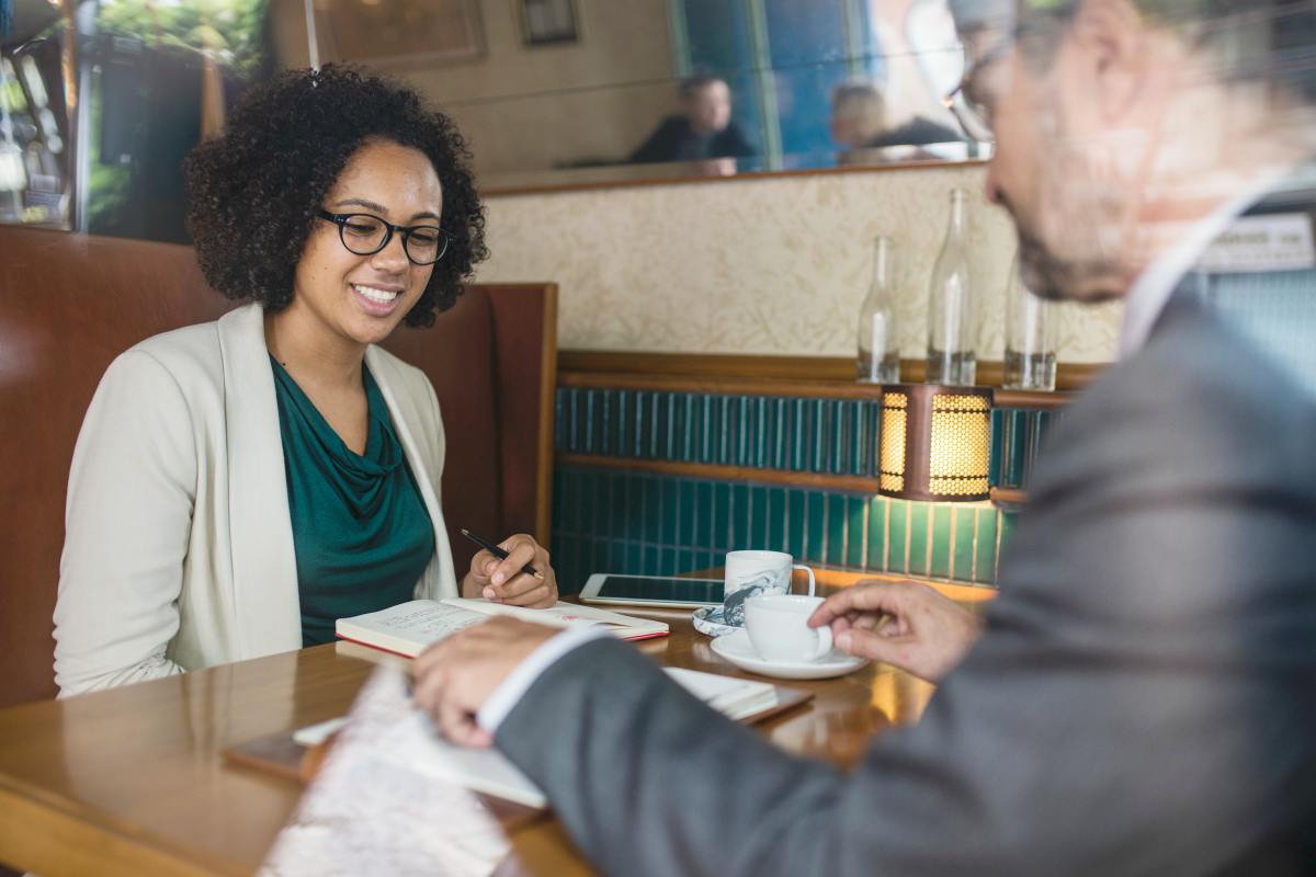 woman holding pen in front of man | Creating A Culture Of Experimentation In Inside Sales w/Blake Johnston @OutboundView | creating culture of experimentation | experimentation culture