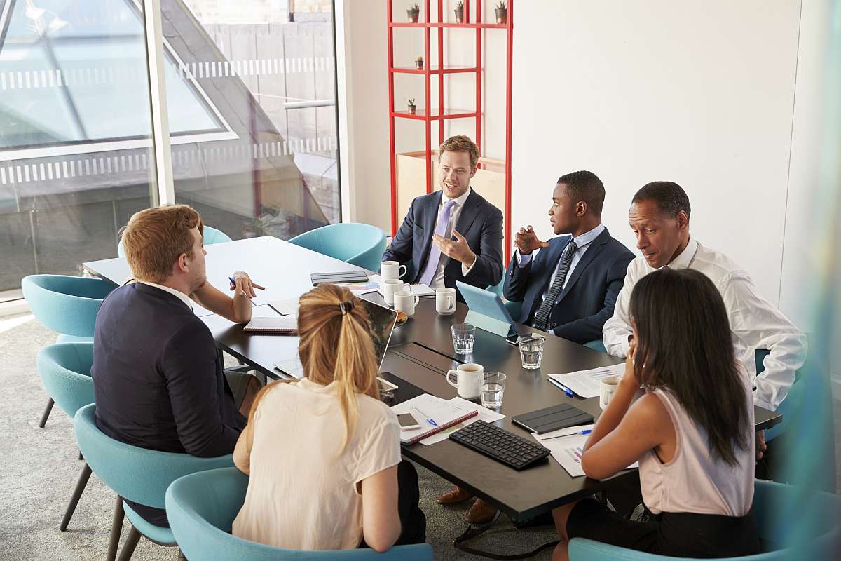 Sales people meeting | Stop Pitching: Start Solving Problems For Your Customers
