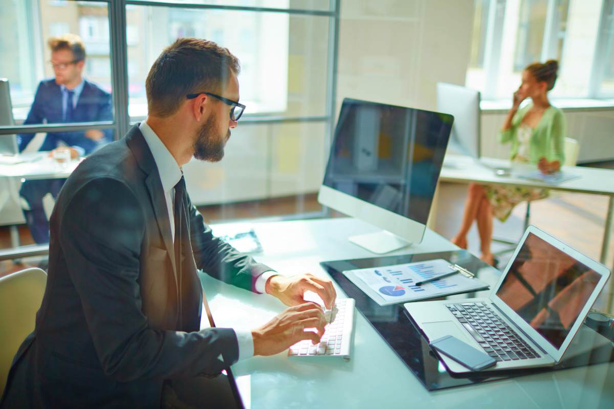 Man working on the computer | Building Rapport with Customers